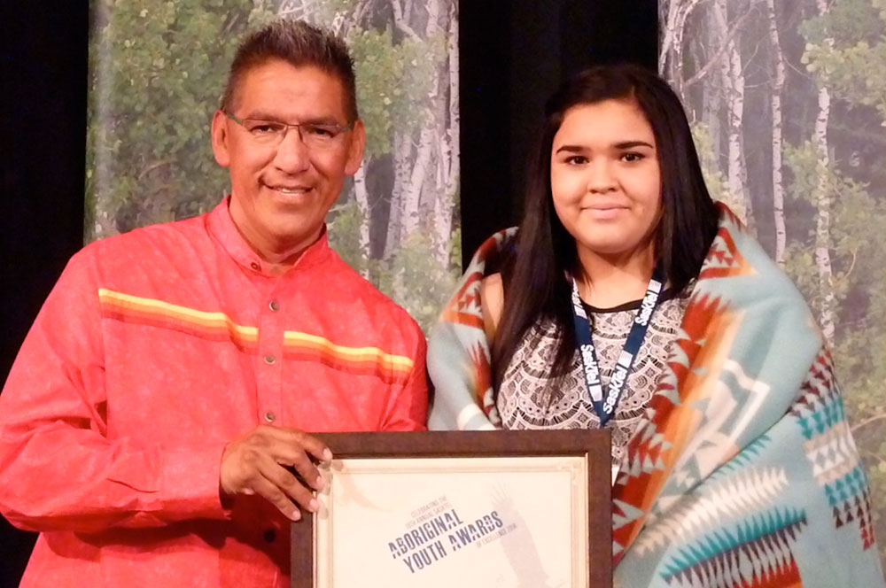 Summer receiving the Leadership award at the SaskTel Aboriginal Youth Awards of Excellence.